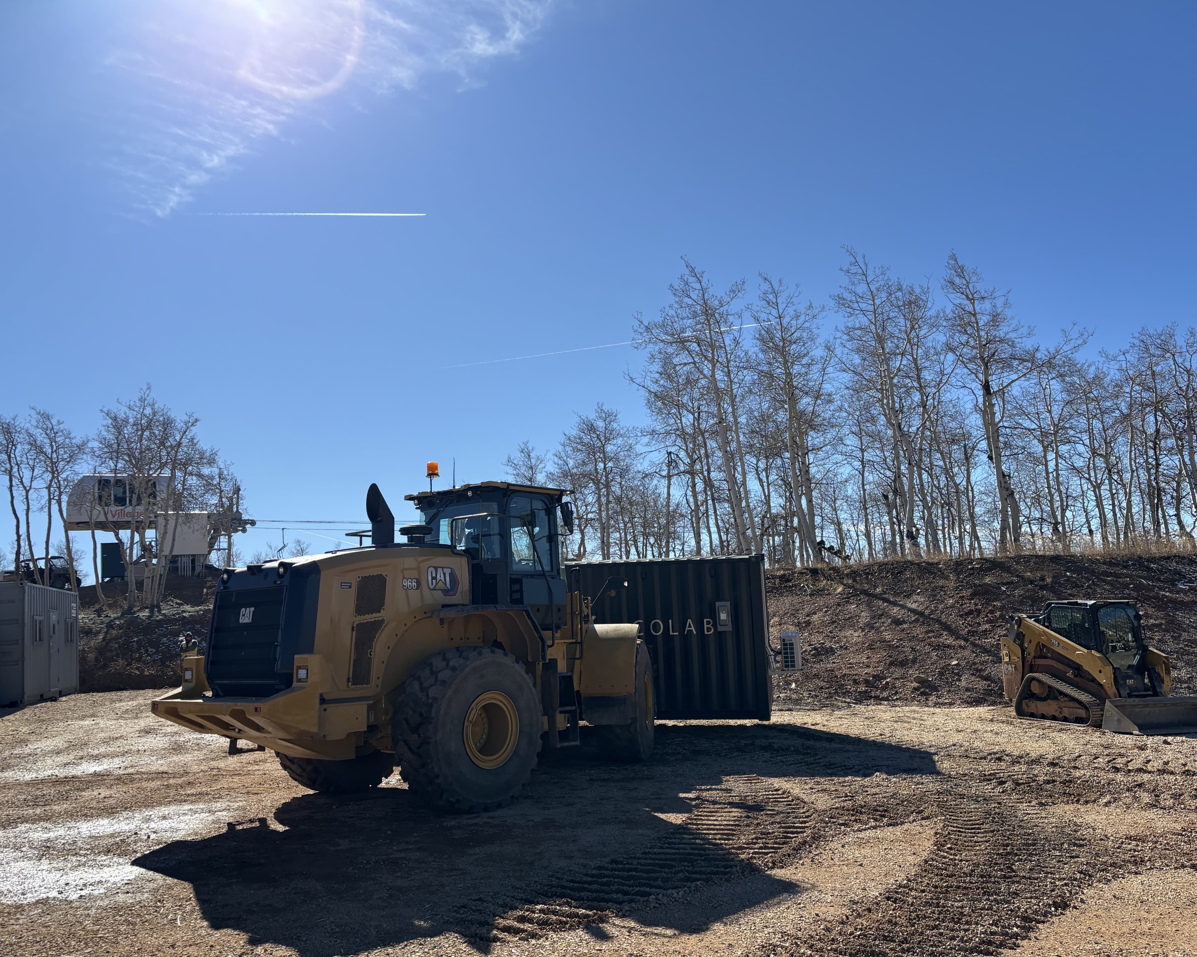 Shipping container being transported to the site